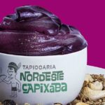 Imagem de um açaí no pote com o logo da Tapiocaria Nordeste Capixaba